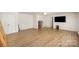 Expansive living room with wood flooring, ample space, and neutral walls, perfect for entertaining at 3882 Shasta Cir, Clover, SC 29710
