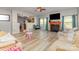 Bright living room featuring hardwood floors, a fireplace, and an open view into the kitchen at 3882 Shasta Cir, Clover, SC 29710