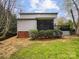Spacious backyard with a screened deck and mature landscaping at 4222 Mt Gallant Rd, Rock Hill, SC 29732