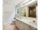 Bright bathroom featuring a double vanity, large mirror and walk-in shower at 4222 Mt Gallant Rd, Rock Hill, SC 29732