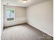 Cozy bedroom with neutral carpet, fresh paint and a window providing natural light at 4222 Mt Gallant Rd, Rock Hill, SC 29732