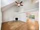 Bright living room featuring vaulted ceilings, a fireplace, and hardwood floors at 4222 Mt Gallant Rd, Rock Hill, SC 29732