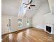 Bright living room featuring vaulted ceilings, a fireplace, and hardwood floors at 4222 Mt Gallant Rd, Rock Hill, SC 29732