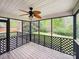 Relaxing screened porch with lattice railing and a ceiling fan, offering serene views of the backyard at 4222 Mt Gallant Rd, Rock Hill, SC 29732