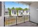 Scenic view from a private balcony overlooking a row of charming townhomes in a peaceful neighborhood setting at 562 Amalfi Dr, Davidson, NC 28036