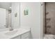 Bathroom with a white sink, vanity, and a shower with chrome fixtures at 562 Amalfi Dr, Davidson, NC 28036