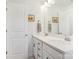 Bright bathroom with double sinks, quartz countertops, and framed mirrors at 562 Amalfi Dr, Davidson, NC 28036