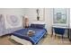 Bedroom with a bed, tapestry, side table, and a window at 562 Amalfi Dr, Davidson, NC 28036