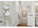 Hallway with a view of a porch and a staircase at 562 Amalfi Dr, Davidson, NC 28036