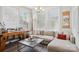 Bright living room with a comfortable sectional sofa, modern decor, and large windows, creating an inviting space for relaxation at 562 Amalfi Dr, Davidson, NC 28036