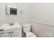 Practical half bathroom with a clean design and essential fixtures at 6001 Plaza Ln, Charlotte, NC 28215