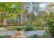 Green backyard featuring a retaining wall and landscaping at 6005 Lanai Ln, Tega Cay, SC 29708