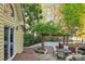 A spacious backyard deck has outdoor dining and access to a lush, landscaped garden at 6005 Lanai Ln, Tega Cay, SC 29708