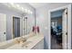 Well-lit bathroom featuring a vanity with a large mirror and access to two separate rooms at 6005 Lanai Ln, Tega Cay, SC 29708