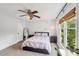 Bedroom with a bed, ceiling fan, and window with natural light at 6005 Lanai Ln, Tega Cay, SC 29708
