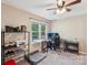 Brightly lit office/bedroom with large window and ceiling fan at 6005 Lanai Ln, Tega Cay, SC 29708