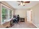 Office/bedroom with view of the outdoors, ceiling fan, closet and white door at 6005 Lanai Ln, Tega Cay, SC 29708