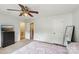 Bedroom with a full-sized bed, a ceiling fan, and a chest-of-drawers with a TV at 6005 Lanai Ln, Tega Cay, SC 29708