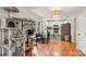 Eat-in kitchen featuring hardwood floors, modern stainless steel appliances, and plenty of natural light at 6005 Lanai Ln, Tega Cay, SC 29708