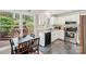 Modern kitchen with stainless steel appliances, black countertops, ample cabinet space and an adjacent dining area at 6005 Lanai Ln, Tega Cay, SC 29708