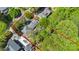 Aerial view of property with red boundary lines showing proximity to neighboring homes and lush trees at 6921 Thermal Rd, Charlotte, NC 28211