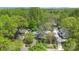 Overhead view of a beautiful home surrounded by lush greenery, offering a serene and private setting at 6921 Thermal Rd, Charlotte, NC 28211