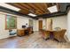 Finished basement has an office area, dining area, wood floors, and stairs at 6921 Thermal Rd, Charlotte, NC 28211