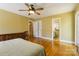 Bedroom with hardwood floors, closet, ceiling fan, and natural light at 6921 Thermal Rd, Charlotte, NC 28211