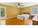 Bedroom with hardwood floors, ceiling fan, and natural light at 6921 Thermal Rd, Charlotte, NC 28211