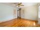 This bedroom has two closets, hardwood floors, a ceiling fan and natural light at 6921 Thermal Rd, Charlotte, NC 28211