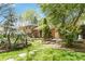 Charming home with lush green lawn and mature landscaping at 6921 Thermal Rd, Charlotte, NC 28211
