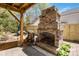 Backyard features a stone fireplace and patio, perfect for outdoor gatherings at 6921 Thermal Rd, Charlotte, NC 28211