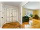 Inviting foyer features double entry doors and hardwood floors that leads to a bright living area at 6921 Thermal Rd, Charlotte, NC 28211