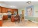 Open kitchen featuring stainless appliances, an island with seating, and tile flooring at 6921 Thermal Rd, Charlotte, NC 28211