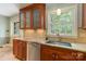Lovely kitchen featuring granite countertops, stainless steel appliances, and a large window at 6921 Thermal Rd, Charlotte, NC 28211