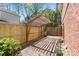Private outdoor patio with brick pavers and pergola for shade and added relaxation and entertaining at 6921 Thermal Rd, Charlotte, NC 28211