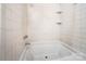 Bright bathroom features white subway tile and a soaking tub at 7050 Forney Hill Rd, Denver, NC 28037