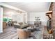 Inviting living room featuring neutral tones, a brick fireplace, and ample seating at 7050 Forney Hill Rd, Denver, NC 28037
