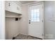 Conveniently located mudroom with storage space and access to the outdoors at 7050 Forney Hill Rd, Denver, NC 28037