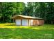 A two-car outbuilding featuring metal construction for durable storage and workspace at 7050 Forney Hill Rd, Denver, NC 28037