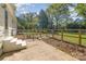 Backyard patio, steps, and fence at 706 Lowell Ave, Lowell, NC 28098