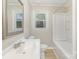 Bathroom showcasing the vanity, toilet, window and bathtub with shower at 706 Lowell Ave, Lowell, NC 28098