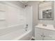 This bathroom offers a bathtub and shower, vanity, and mirror at 706 Lowell Ave, Lowell, NC 28098