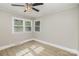 Light and airy bedroom featuring neutral walls, wood-look flooring, and bright windows for natural light at 706 Lowell Ave, Lowell, NC 28098