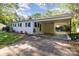 Spacious carport attached to a one-story home, offering ample parking and protection from the elements at 706 Lowell Ave, Lowell, NC 28098