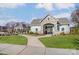 Charming community building with stone accents, lush landscaping, and inviting entrance walkway at 8034 Downy Oak Ln, Charlotte, NC 28269