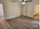 Neutral bedroom boasts wood look flooring, ceiling fan, and bathroom access at 833 Arlington Ave, Rock Hill, SC 29730