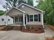 Charming single-story home with a welcoming porch and well-maintained landscaping at 833 Arlington Ave, Rock Hill, SC 29730