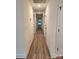 Well lit hallway features wood grain floors, neutral paint and white doors at 833 Arlington Ave, Rock Hill, SC 29730