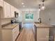 Spacious kitchen with white cabinets, granite countertops, and stainless steel appliances at 833 Arlington Ave, Rock Hill, SC 29730
